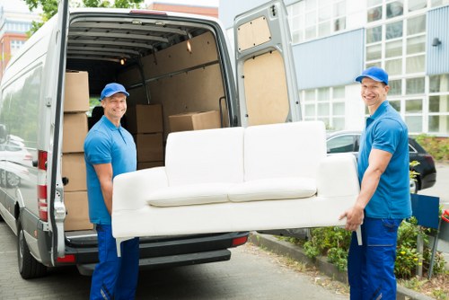 Professional movers handling household items in Storage Highbury
