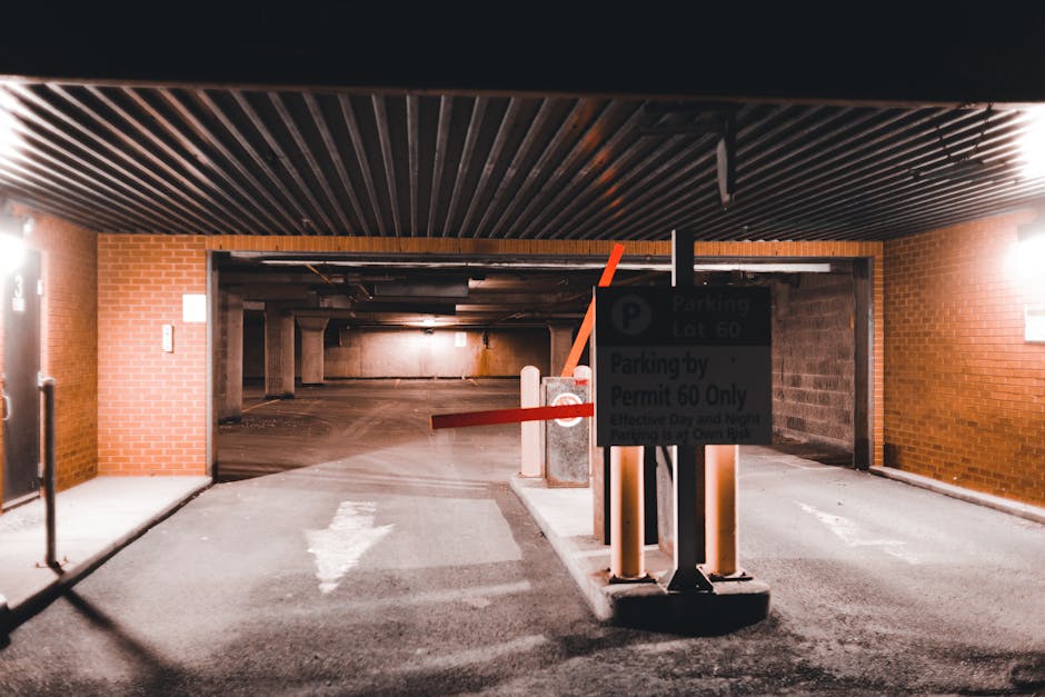 A yellow warning sign attached to a metal pole displays the message 'Parking suspension' in black text, indicating temporary removal of parking restrictions for moving or home relocation activities. T
